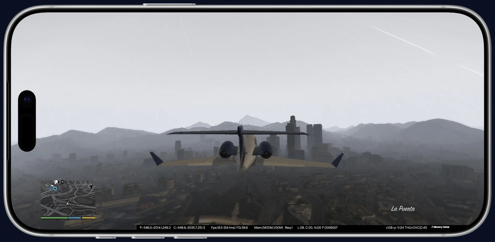 GTA V on an iPhone 17 Pro Max: flying a jet towards downtown Los Santos.